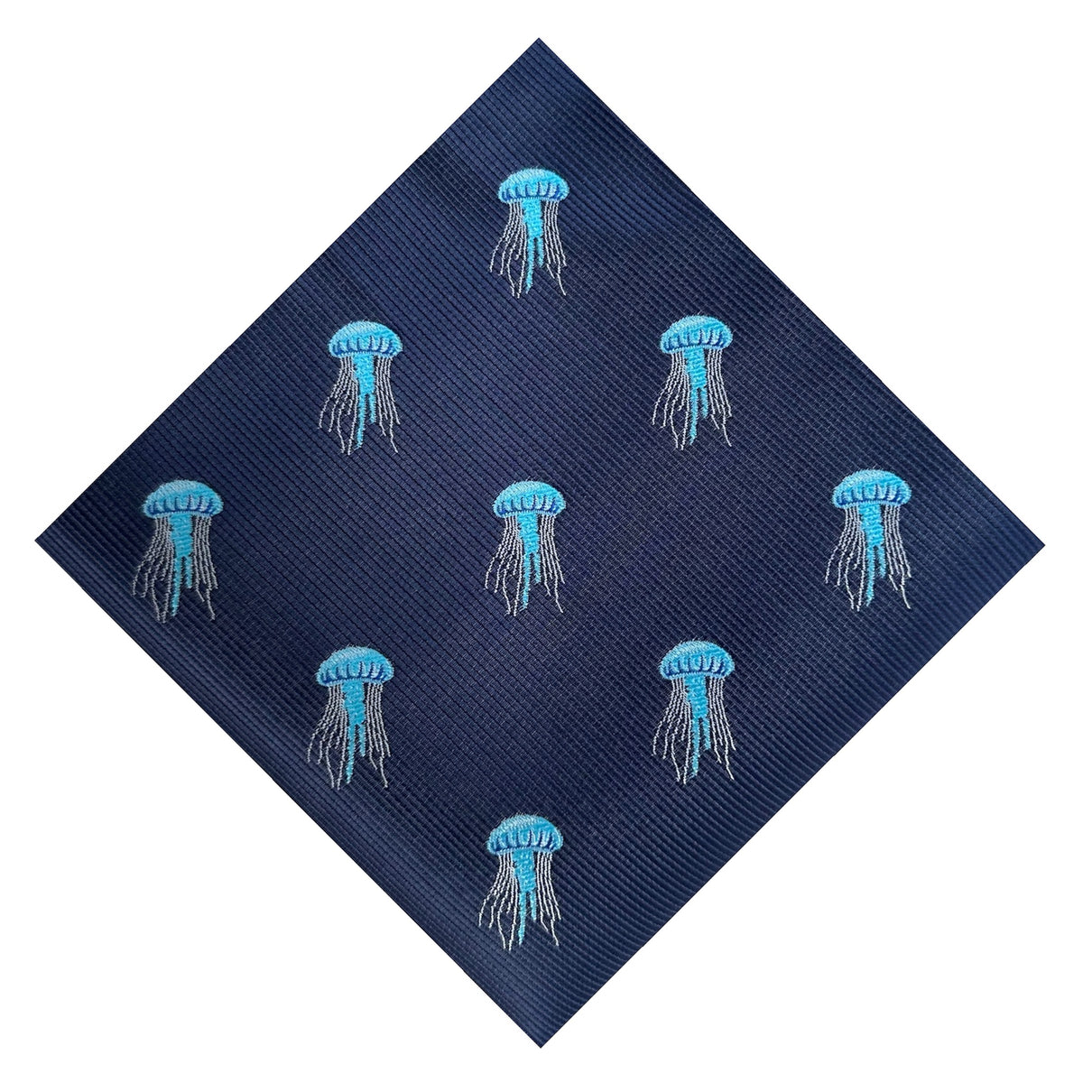 A blue pocket square with embroidered jellyfish designs on it.