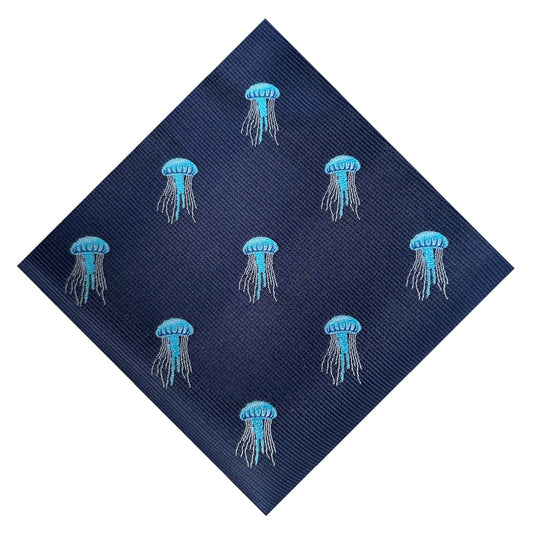 A blue pocket square with embroidered jellyfish designs on it.