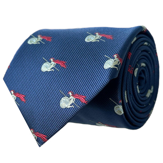 A rolled-up blue necktie with gold and red embroidered pattern featuring a Spartan warrior design.